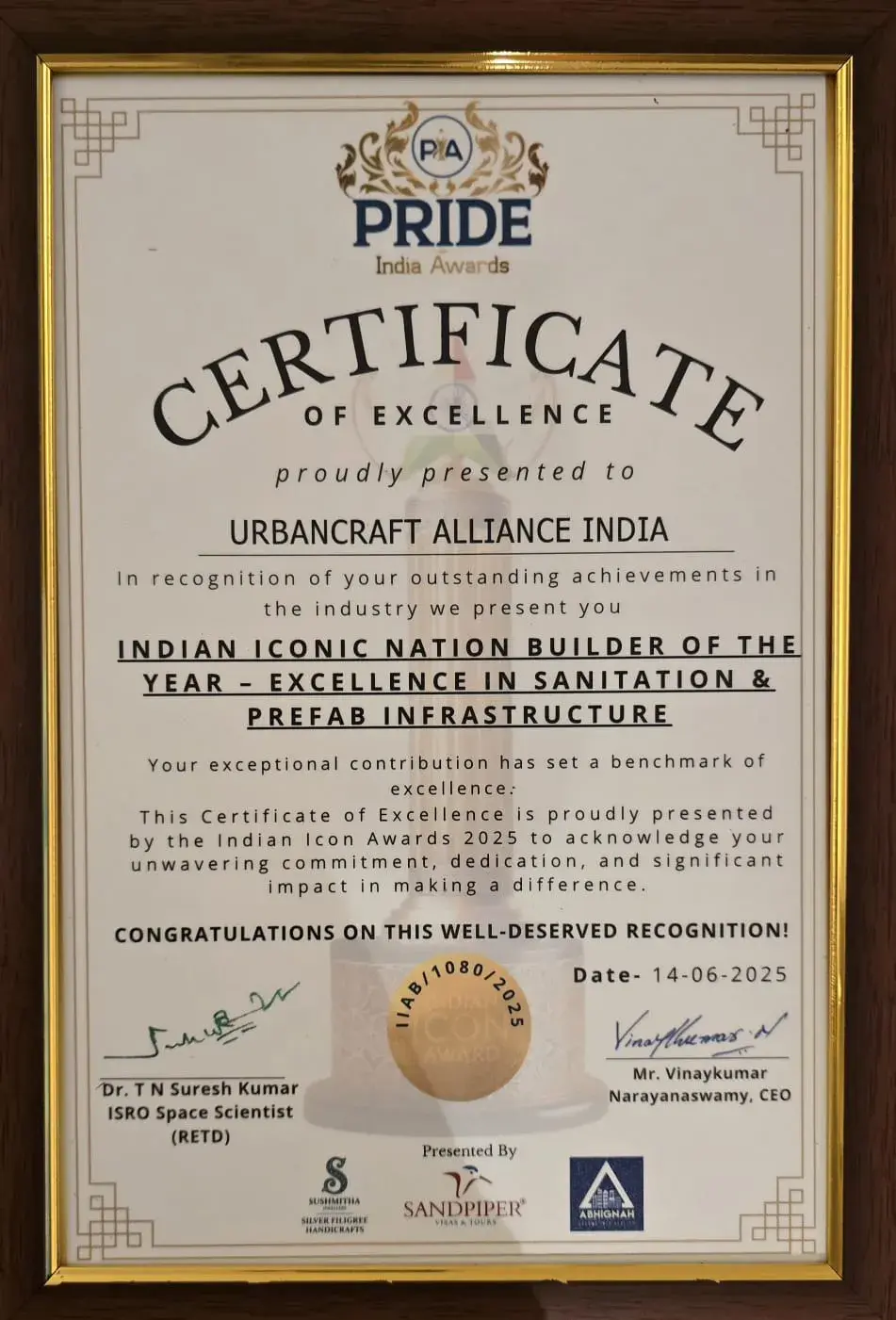 Pride India Awards 2025 trophy presented to UrbanCraft Alliance India for excellence in prefab and sanitation infrastructure